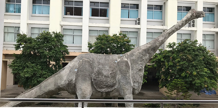 a concrete dinosaur